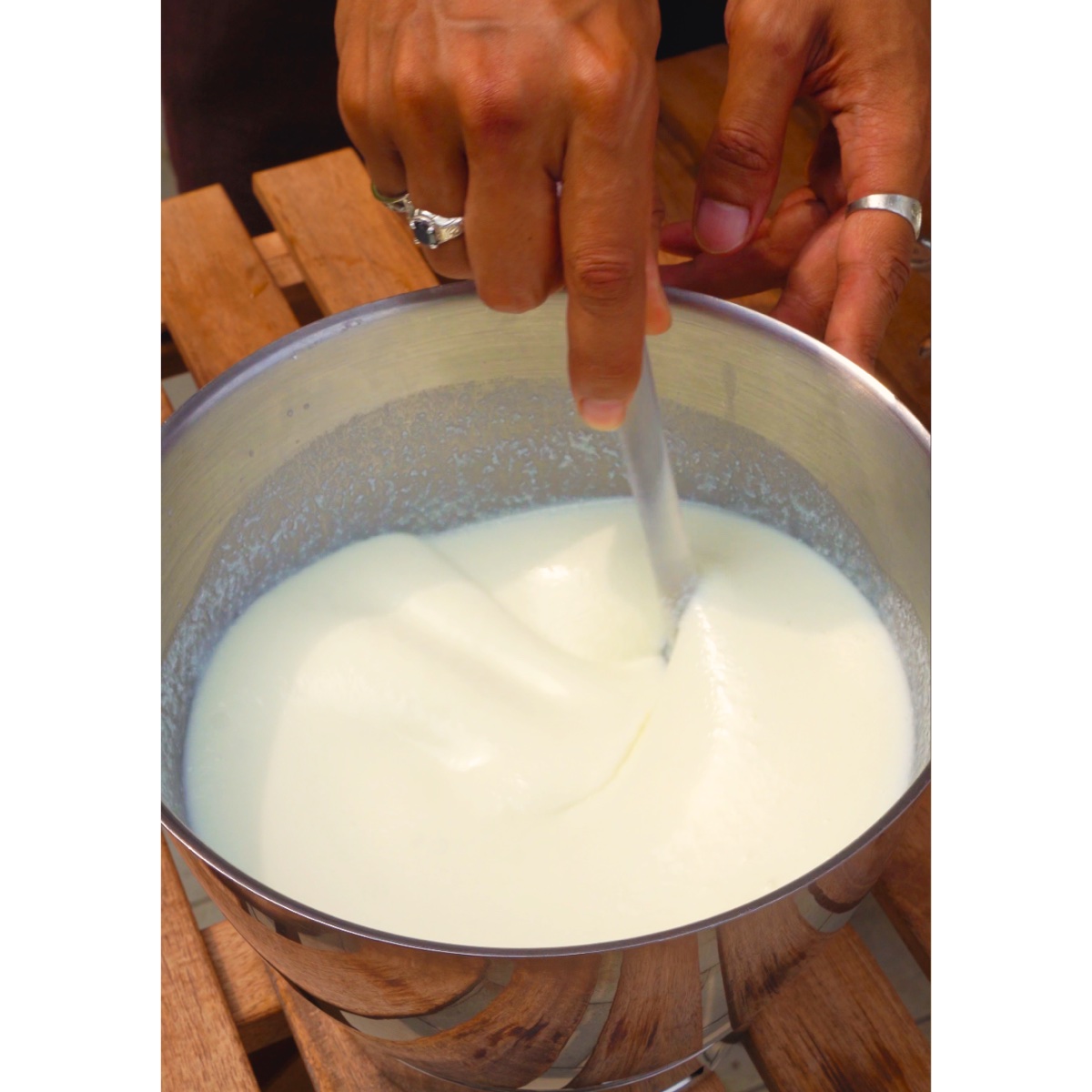 Milk kefir being made by hand